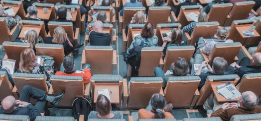 overhead image of students in auditorium